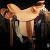 Wade tree, 15 inch seat, Gullet - 7 and 1/2 inch by 6 and 1/4 inch by 4 inch, Horn  4&1/2 inch round, 90 degree bars, 7/8ths full in-skirt riggin, Cheyenne Roll, Buckaroo outside leathers, half-breed Wade Saddle built and tooled with original floral and border design by Keith Valley.